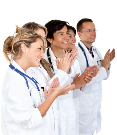 Group of doctor applauding isolated over a white background