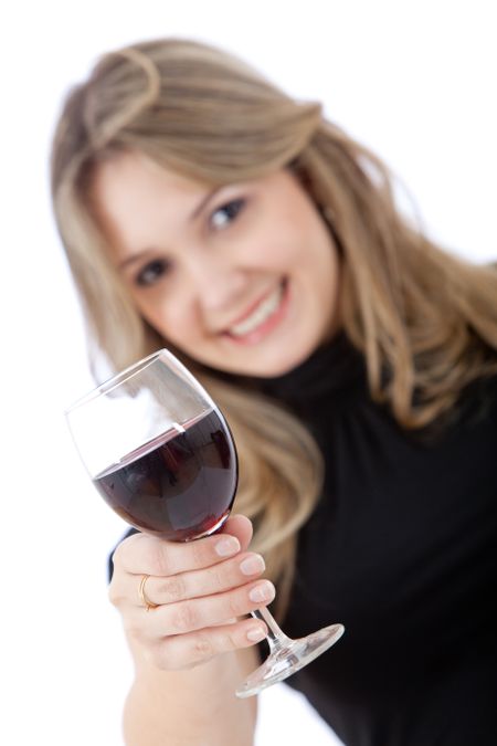 Beautiful happy woman with a glass of wine isolated on white