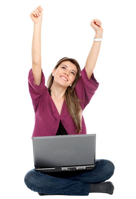 Excited girl with a computer isolated on white