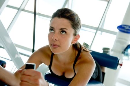 Beautiful woman doing exercise at the gym