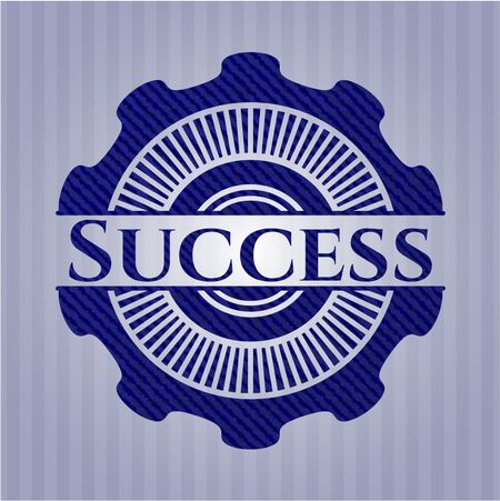 Success emblem with jean background