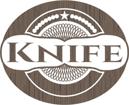 Knife badge with wood background