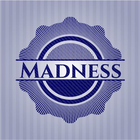 Madness emblem with denim high quality background