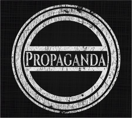Propaganda chalk emblem written on a blackboard