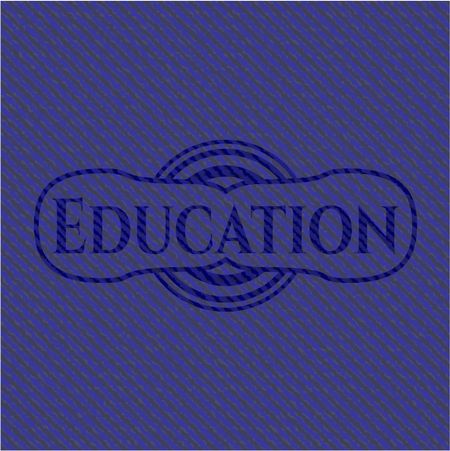 Education emblem with denim high quality background