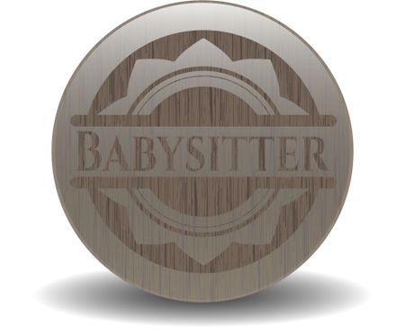 Babysitter badge with wooden background