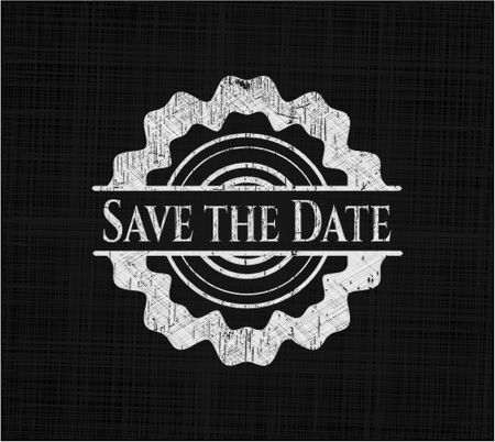 Save the Date chalk emblem written on a blackboard