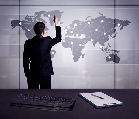 A young office worker drawing on world map and connecting dots with lines, presenting marketing sterategy at office environment concept