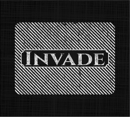 Invade chalkboard emblem on black board