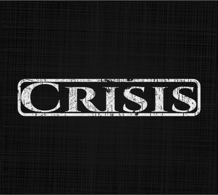 Crisis chalk emblem written on a blackboard