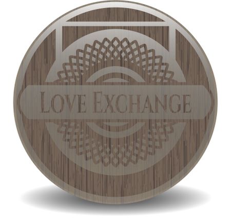 Love Exchange badge with wood background