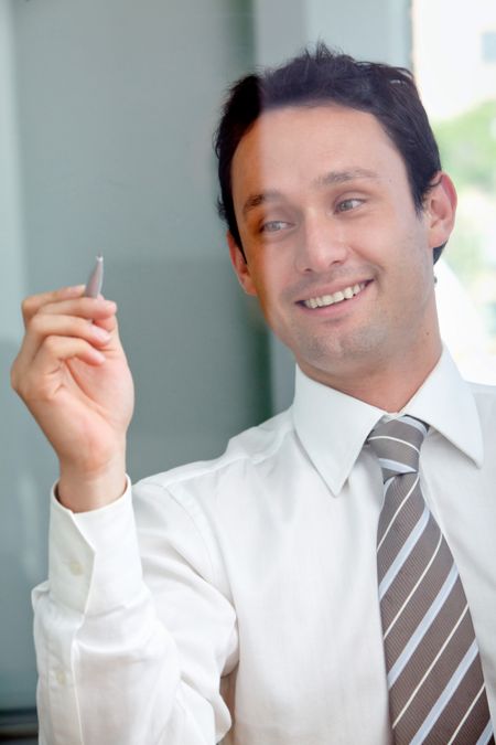 business man smiling and drawing on screen