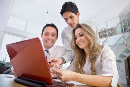 Group of business people on a laptop in an office