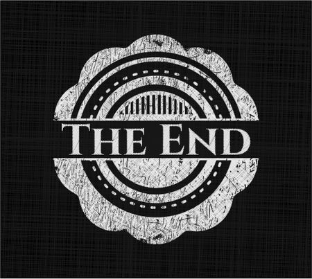 The End chalk emblem written on a blackboard