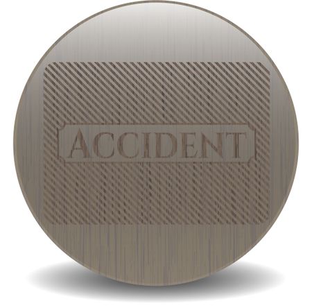 Accident badge with wooden background