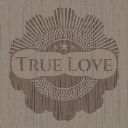 True Love badge with wood background