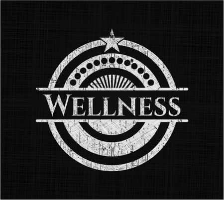 Wellness chalk emblem written on a blackboard