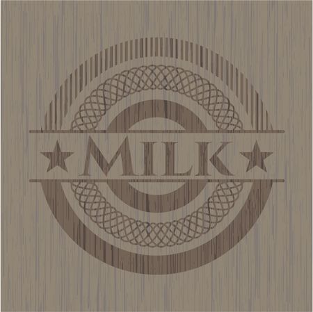Milk badge with wooden background