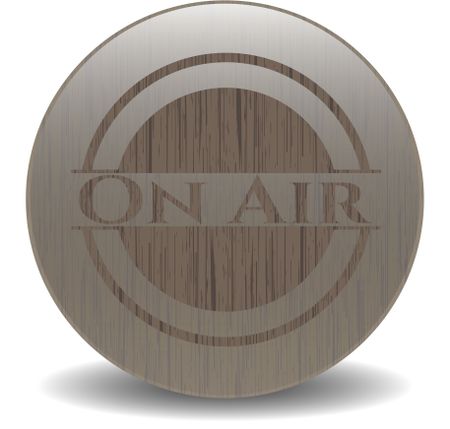 On Air badge with wooden background