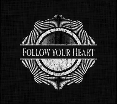 Follow your Heart chalk emblem written on a blackboard