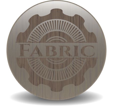 Fabric badge with wooden background