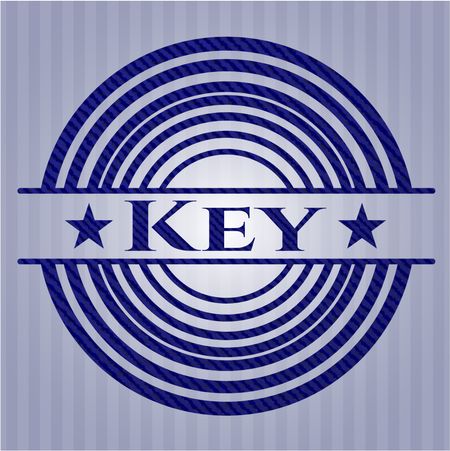 Key badge with denim background