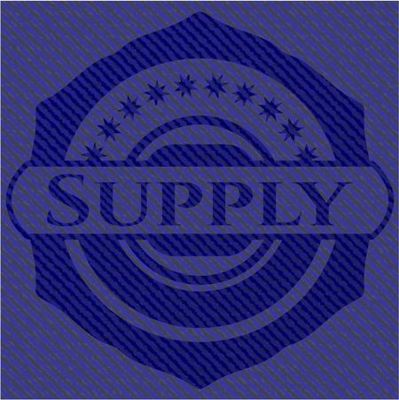 Supply badge with denim background