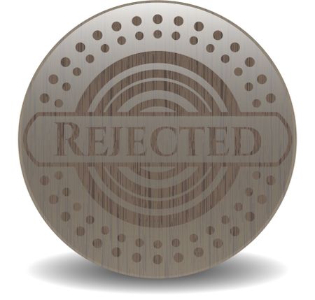 Rejected badge with wooden background