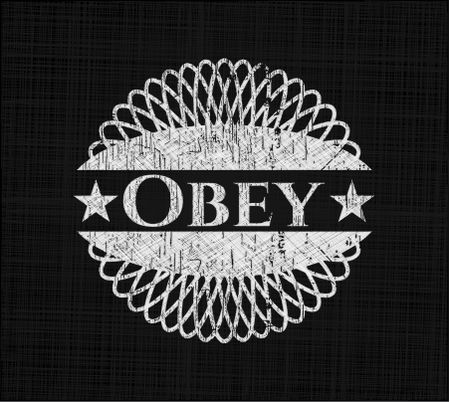 Obey chalkboard emblem written on a blackboard