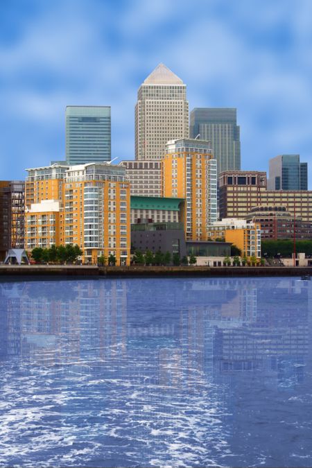business village view with a river at the front - canary wharf in London, UK