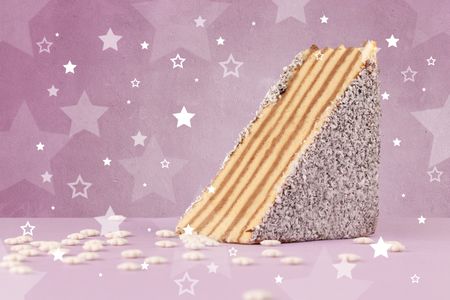 Close up of a delicious colorful cake with star shapes on background 