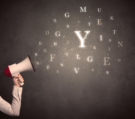 Caucasian arm holding megaphone with letter cloud