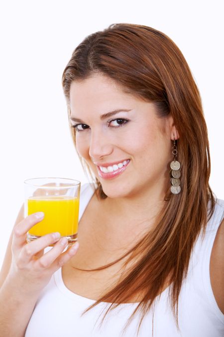 Woman drinking orange juice isolated over a white background