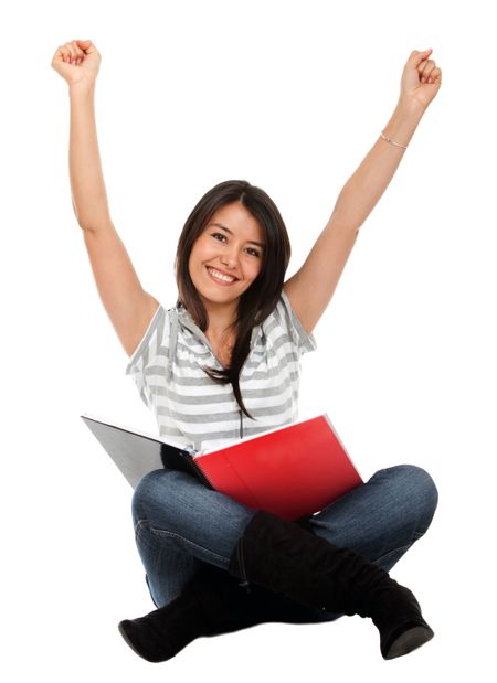 Happy female student with a notebook isolated over a white background