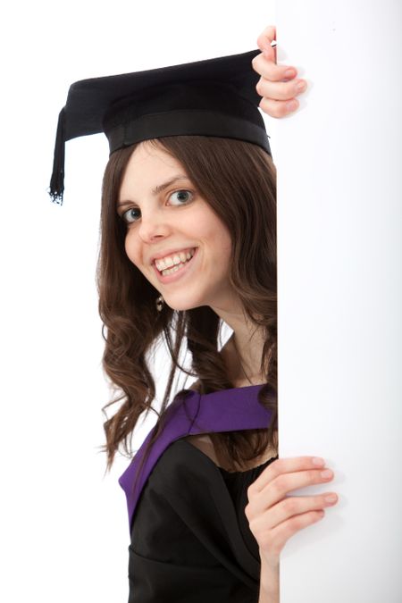 Grad female student with a banner isolated over a white background