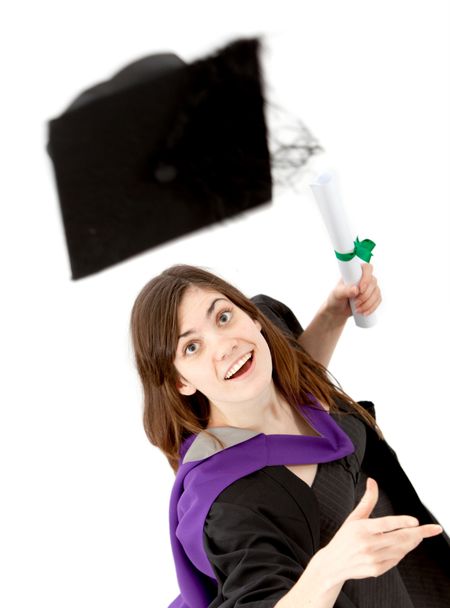 Graduation woman throwing her mortarboard isolated over a white background