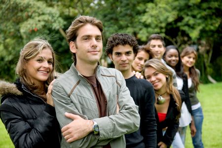 Group of casual people outdoors and smiling