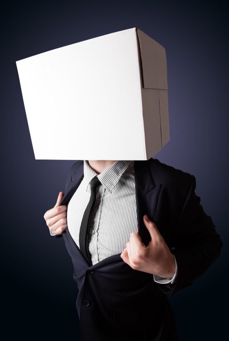 Businessman standing and gesturing with a cardboard box on his head