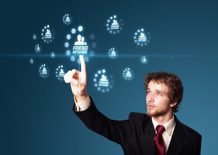 Businessman pressing modern social buttons on a virtual background