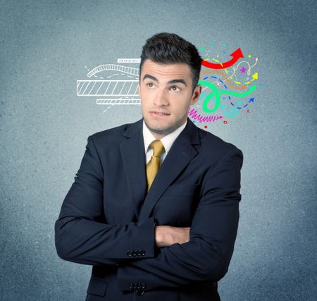 A handsome sales person standing in front of a blue  urban concrete wall with illustration expressing creativity by transforming white lines to colorful arrows cocncept