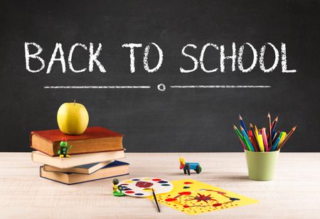 back-school-concept-writing-blackboard-capital-453573835 Back to school concept with writing on blackboard in capital letters and a desk with papers, fruit