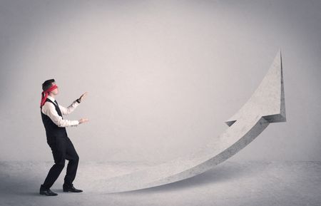A scared blindfolded businessman forced to face a problem concept with illustrated arrow pointng to the sky in empty space.