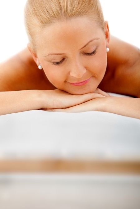 Woman at the spa relaxed isolated on white