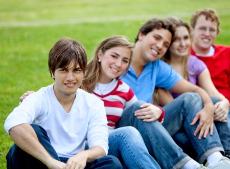 Happy group of friends together in the park