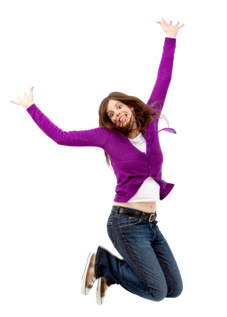 Excited woman jumping isolated over a white background