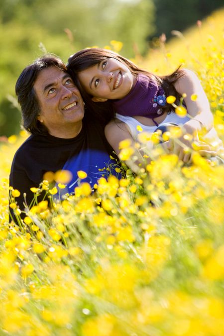 Beautiful father and daughter portrait outdoors smiling