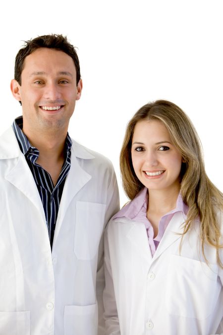 Couple of young doctors isolated over a white background