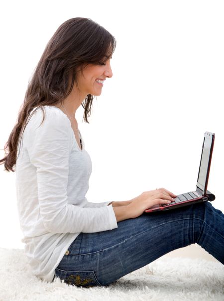 Woman smiling with a laptop isolated over white