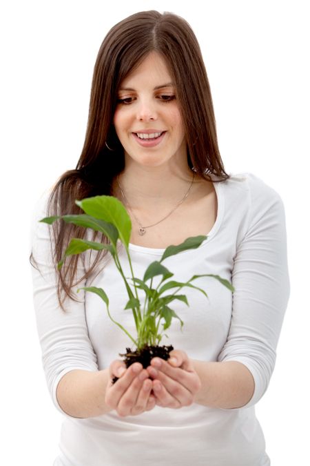 woman holding a plant in her hands isolated over a white background