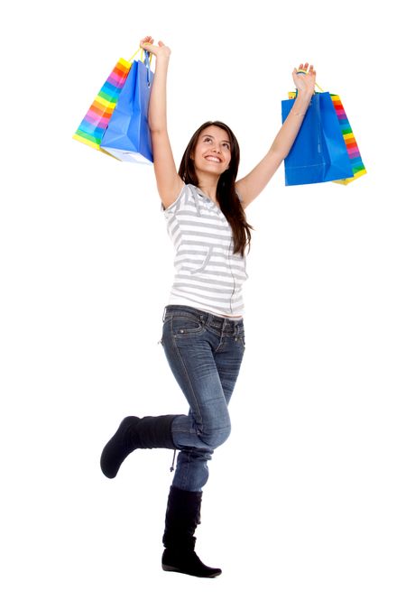 Girl with shopping bags isolated over a white background